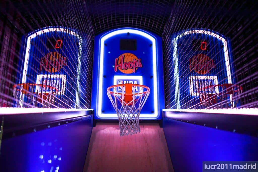 A colorful indoor arcade game showcasing basketball hoops in a vibrant setting, perfect for entertainment venues.