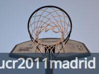 Close-up view of a basketball hoop and net against a clear sky, ideal for sports and leisure themes.